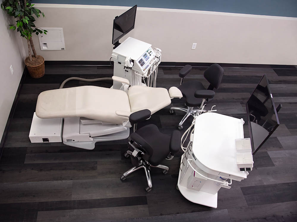 10' x 12' operatory with classic cart and freedom assistants cart with in-floor junction box